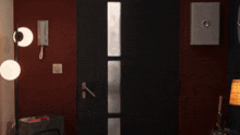 a door with a phone on it and a lamp