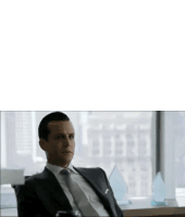 a man in a suit and tie sits in front of a window and says " quem não gosta de mim "