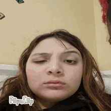 a girl is making a funny face with flipa clip written on the bottom