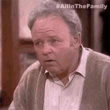 saddened archie bunker all in the family unhappy upset