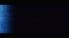 a dark background with a few spots of light