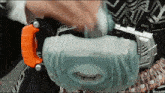 a person is wearing a belt that has a handle on it that says ' gt ' on it