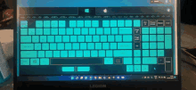 a legion laptop is turned on and displaying a green keyboard