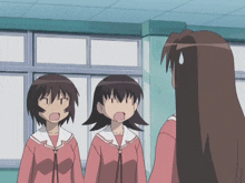 a girl with a surprised look on her face stands between two other girls