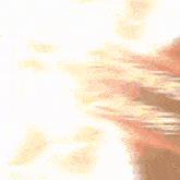 a blurred image of a person 's face with a white background behind them