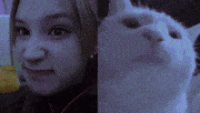 a close up of a woman 's face and a close up of a cat 's face