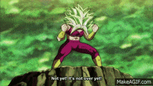 a cartoon character is standing on a rock and says not yet it 's not over yet .