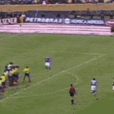 a blurry picture of a soccer game with a player wearing a number 1 jersey