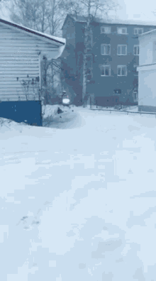a man is riding an atv through the snow