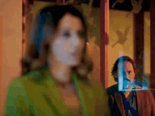 a blurry picture of a woman and a man with birds on the window