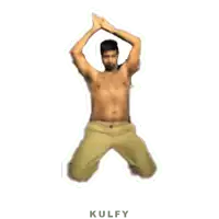 a shirtless man in khaki pants is jumping in the air with his hands in the air .