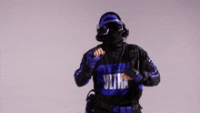 a person wearing a black and blue ultra sweatshirt