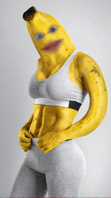 a woman with a banana head is wearing a grey sports bra