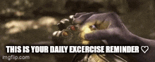 a person is holding a infinity gauntlet in their hand .
