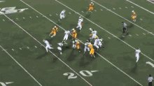 a football game is being played on a field with a large ucsd logo in the background