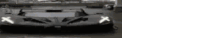 a black and white photo of a sports car with x 's on its headlights .