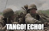 two soldiers are sitting in a trench and one of them is saying " tango echo "