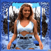 a woman in a crop top and shorts is standing in a blue frame