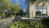 an artist 's impression of a house with lots of flowers and trees