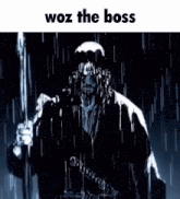 a man is holding a sword in the rain .