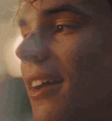 a close up of a man 's face with water dripping from his nose
