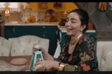 Lady In Floral Dress Smile GIF - Lady In Floral Dress Smile Cheese Grater GIFs