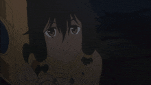 a girl with a necklace around her neck looks at the camera