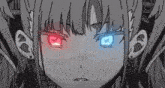 a girl with red and blue eyes is looking at the camera .