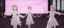three anime girls are dancing on a stage holding hands
