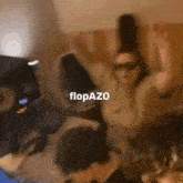 a blurry picture of a group of people with the word flopazo on the bottom right