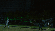 a person in a superhero costume is standing in front of a firework display