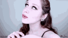 a close up of a woman 's face with the word lillee jean productions on the bottom
