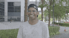 a man wearing glasses and a black hat with the word nike on it