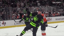 a hockey game is being played in front of a banner for dr. pepper
