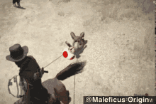 a man riding on the back of a horse pulling a rabbit on a leash in a video game