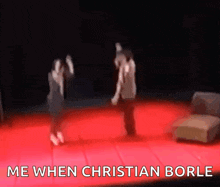 a blurry picture of two people dancing on a stage with the words me when christian borle