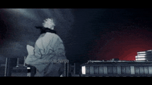 a man in a white robe is standing in front of a building with the words ninjaisticninja on the bottom right