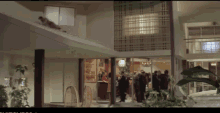 a man is laying on the roof of a building in a room