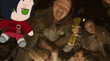a group of people are gathered around a stuffed animal with a red shirt that says 00
