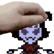 a person is petting a pixel art character with their hand .