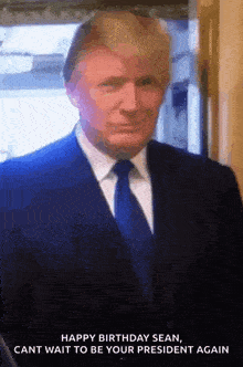 a man in a suit and tie is standing in front of a window .