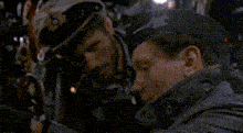 two men are hugging with the words read the manual on the bottom right