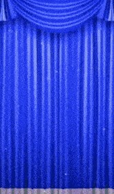 a man and a woman are peeking out from behind a blue curtain
