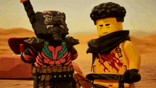 two lego figures standing next to each other with one wearing a scarf that says ' o ' on it