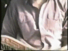 a close up of a person 's torso with a blurred background .