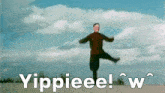 a man is standing on one leg in front of a cloudy sky with the words yippieee ! w written on the bottom