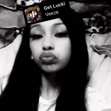 a woman wearing a hat that says get lucki veeze