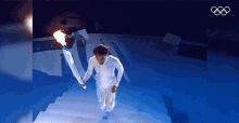 Running Up The Stairs Olympic Flame GIF - Running Up The Stairs Olympic Flame Olympic Fire GIFs