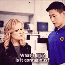 a man and a woman are standing next to each other and the woman is asking the man what 's lte is it contagious