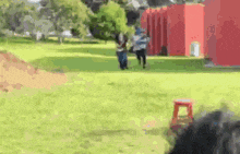a blurry picture of two people walking in a park